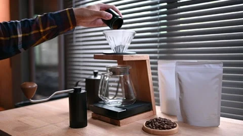 Close up hand drip coffee by Pour the ground coffee beans. into the filter paper Stock Footage 167792431