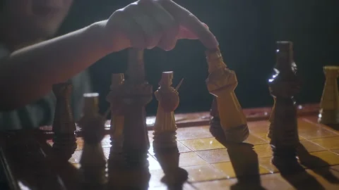 Close up hand dropping the chess king to resign at the end of a lost game. Stock Footage 149318550