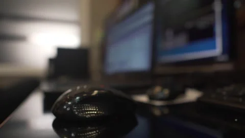 Close-up hand of an engineer is holding the computer mouse in the control room Stock Footage 133487064
