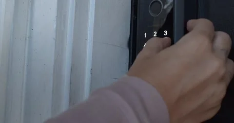 Close up of Hand Entering Numerical Code on Smart Lock and Opening Door Stock Footage 340293956