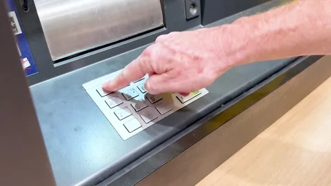 Close-up of hand entering pin code on ATM keypad, financial transaction mot.. Stock Footage 333876970