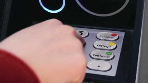 Close-up of hand entering PIN code on ATM keypad. Banking, finance, security and Stock Footage 334719512