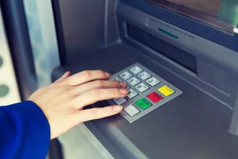 Close up of hand entering pin code at cash machine 库存照片