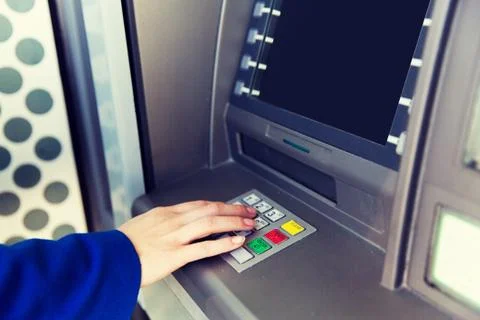 Close up of hand entering pin code at cash machine Stock Photos