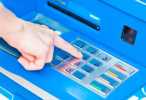 Close-up of hand entering PIN/pass code on blue ATM/bank machine keypad Stock Photos