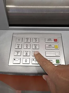 Close-up of hand entering PIN/pass code on ATM/bank machine keypad 스톡 사진