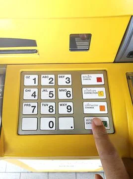 Close-up of hand entering PIN/pass code on ATM/bank machine keypad 스톡 사진