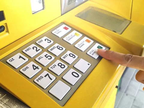 Close-up of hand entering PIN/pass code on ATM/bank machine keypad 스톡 사진