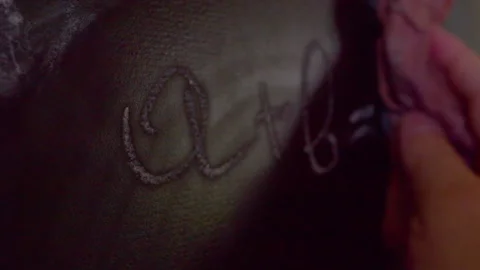 Close up of hand erasing math formula A plus B equals AB from chalkboard Stock Footage 335191340