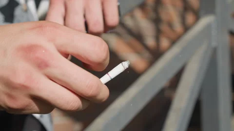 close up hand flicking cigarette while r... | Stock Video