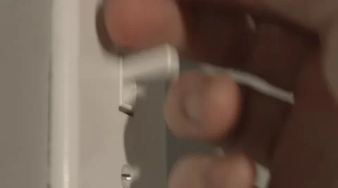 Close up of a hand flipping OFF a light switch in 4K Stock Footage 47291545