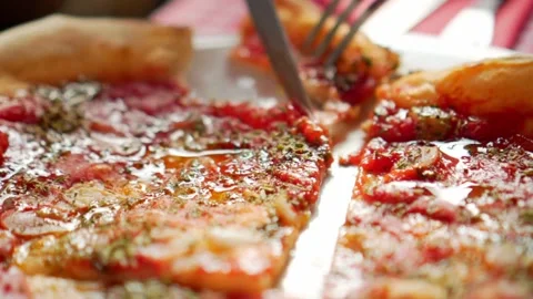 Close up a hand fork taking a slice pizza. hands of male taking pizza slices at Stock-Footage 336586727