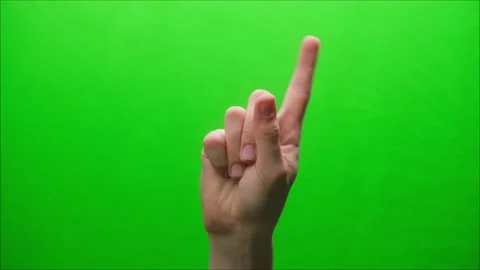 Close-up of a hand gesture on a green background, shooting a gesturing in studio Stock Footage 154817392