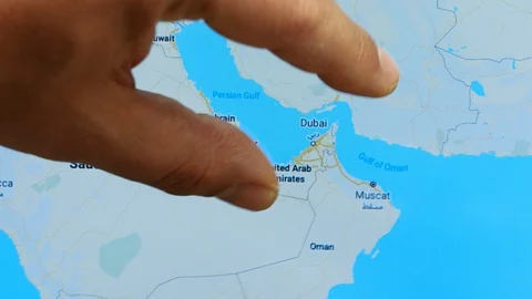 Close up hand gesture on touch screen zoom in Dubai city Stock Footage 128461160