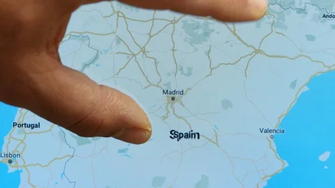 Close up hand gesture on touch screen zoom in madrid city Spain Stock Footage 128505366