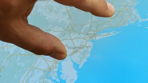 Close up hand gesture on touch screen zoom in new york city USA or America Stock Footage 128506031