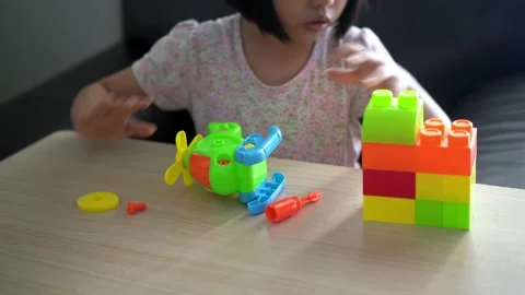 Close up the hand of a girl play assembl... | Stock Video | Pond5