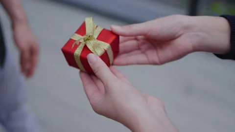 Close up hand giving red gift box festival happy new year christmas 2022 Stock Footage 159750482