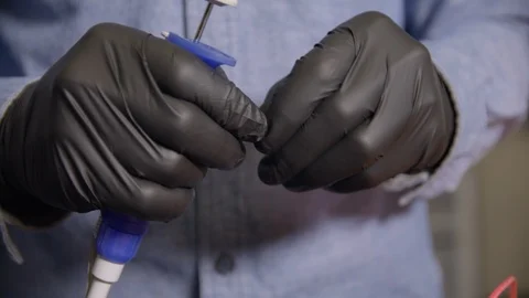 Close-Up Of The Hand In Glove Using Micropipette While Working With Test Tubes Stock Footage 112161328