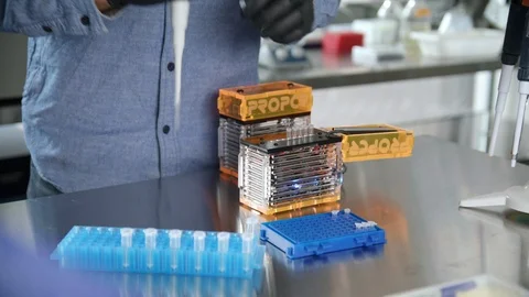 Close up of hand in gloves using micropipette while working with test tubes 스톡 동영상 112158694