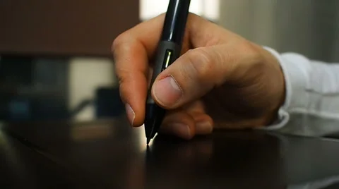  Close up of the hand of a graphic designer holding an electronic Stock Footage 67218801