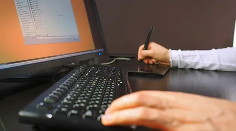 Close up of the hand of a graphic designer holding an electronic Stock Footage 67219944