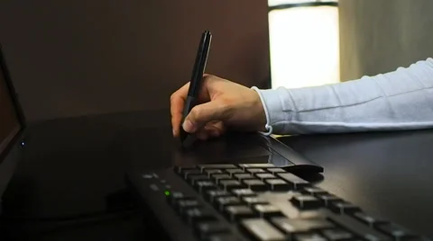 Close up of the hand of a graphic designer using electronic stylus Video stock 67219406