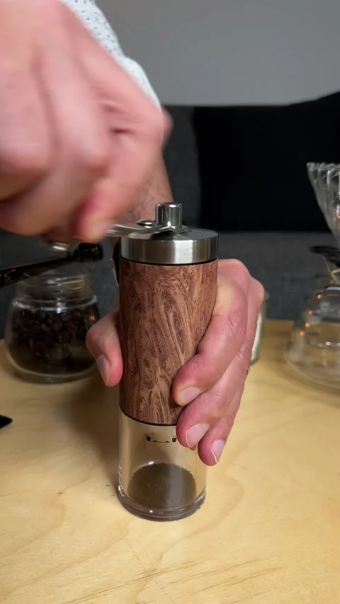 Close-Up of Hand Grinding Coffee Beans with a Manual Wooden Coffee Grinder, Stock-Footage 297700970