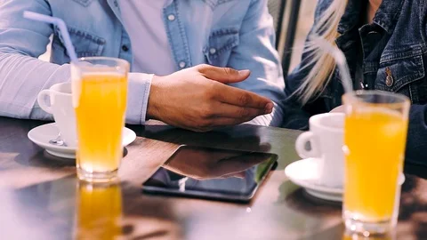 Close up on hand in hand of young couple that sitting at cafe Video stock 89825130