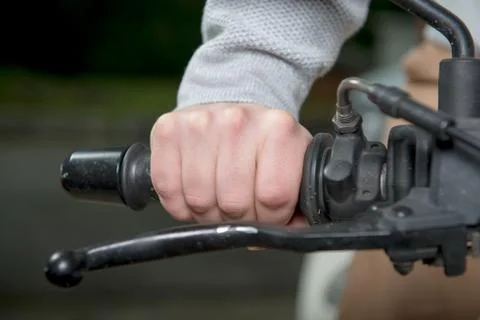 Close up of hand on handlebar Stock Photos
