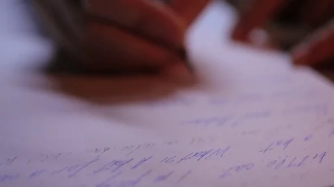 Close-up of a hand, he wrote a letter on paper. The old feather pen. Stock Footage 72163310