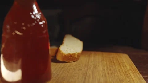 Close up hand hits the table with dry fish beer snack, ex soviet USSR tradition Stock Footage 279230656