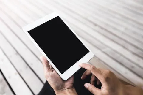 Close-up hand hold digital tablet blank screen outdoor lifestyle Stock Photos