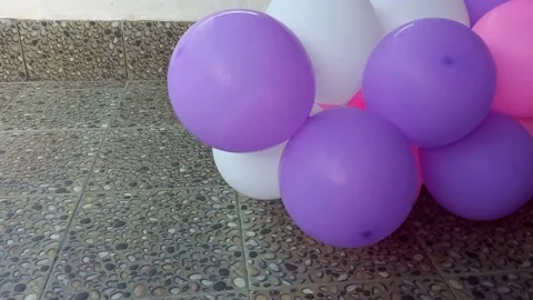 Close up hand holding and pumping a balloon Stock Footage 236371749
