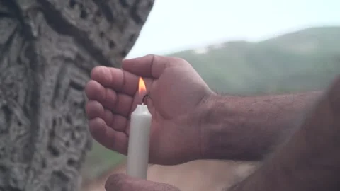 Close-up of a hand holding a candle Video stock 142380441
