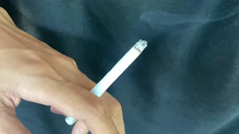 Close up of hand holding cigarrate Stock Footage 195281026