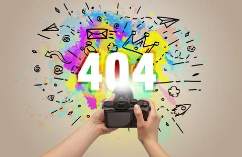 Close-up of a hand holding digital camera with abstract drawing Stock Photos