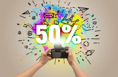 Close-up of a hand holding digital camera with abstract drawing concept Foto stock