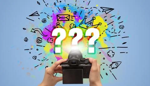 Close-up of a hand holding digital camera with abstract drawing concept Foto stock