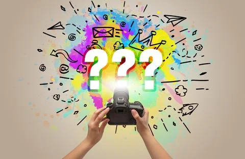 Close-up of a hand holding digital camera with abstract drawing concept Stock Photos