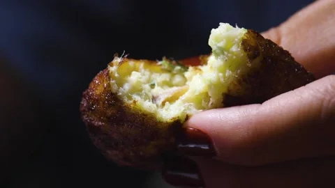 A close up of a hand holding a donut Stock Footage 155453063