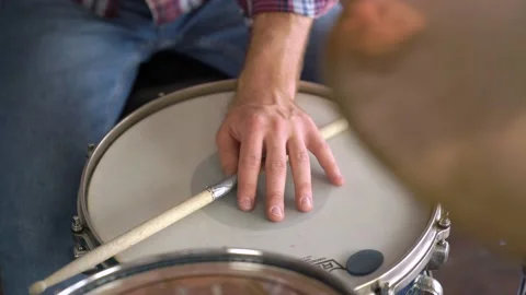 Close Up of the hand holding the drum stick beats the rhythm on the drums Stock Footage 155554510