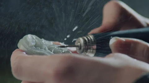 Close up of hand holding electric drill for carving jade, China Stock Footage 140765628