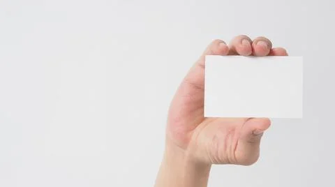 Close up of hand holding empty small card on white background. Stock Photos