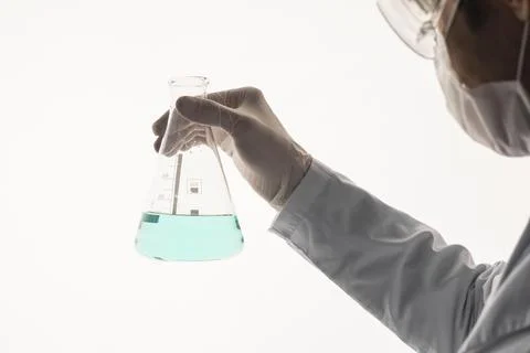 Close up hand holding erlenmeyer flask 2 Resolution and high quality beautiful Stock Photos