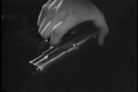 Close-up of hand holding gun Stock Footage 11353260