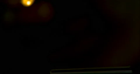 Close up of a hand holding a match and striking it, in the dark. Slow motion sho Stock Footage 199459386
