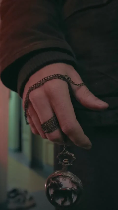 Close-Up of Hand Holding Pocket Watch with Chain Stock Footage 299577791