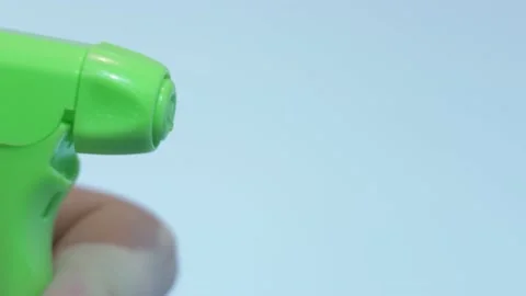 Close up of hand holding pulverizer spraying water Stock Footage 134069663