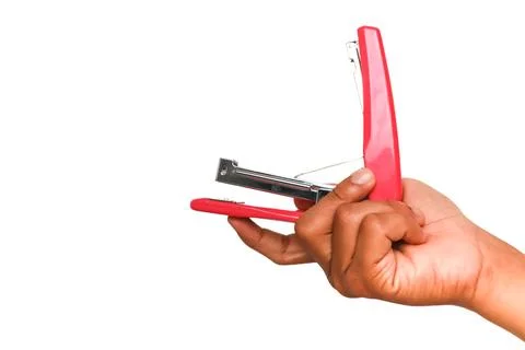 Close up of a hand holding a red stapler, ready to use, isolated on white b.. Foto stock